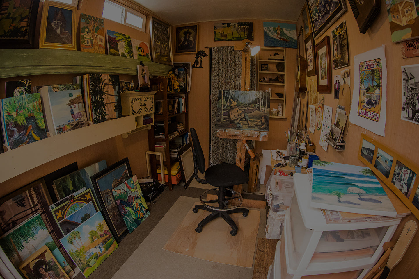 Photo inside Joe Severson's art studio. Showing paintings and collectables on display.